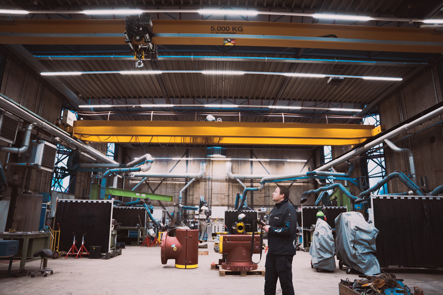Employee operates a crane